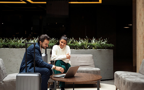 Business travelers in luxury hotel lobby